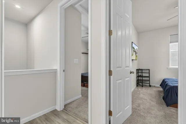 a bathroom with a granite countertop sink toilet a mirror a vanity and shower