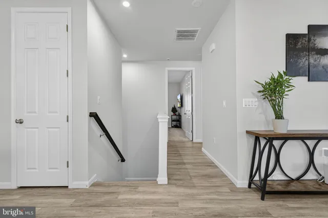 a living room with furniture and a chair