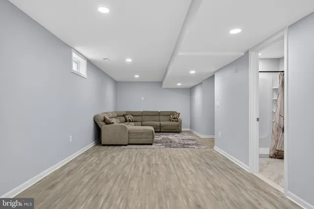 a balcony view with a couch and wooden floor