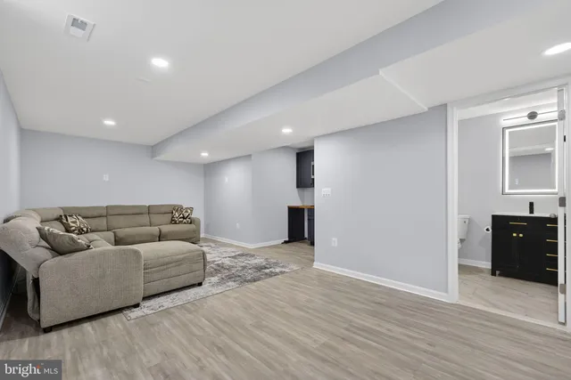 a outdoor living space with furniture and a potted plant