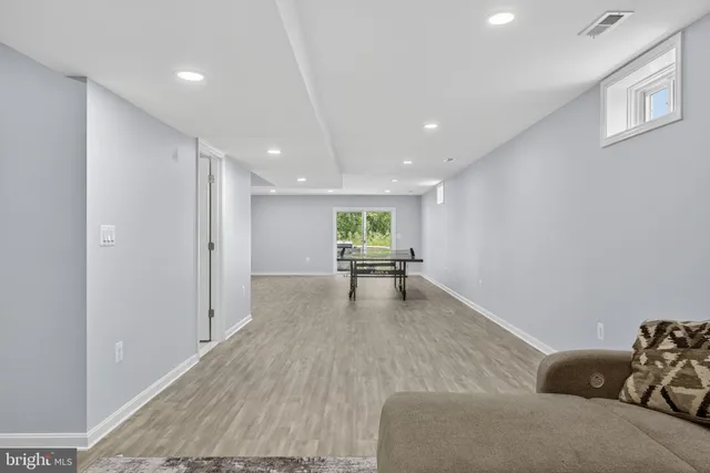 a view of a swimming pool and sitting area