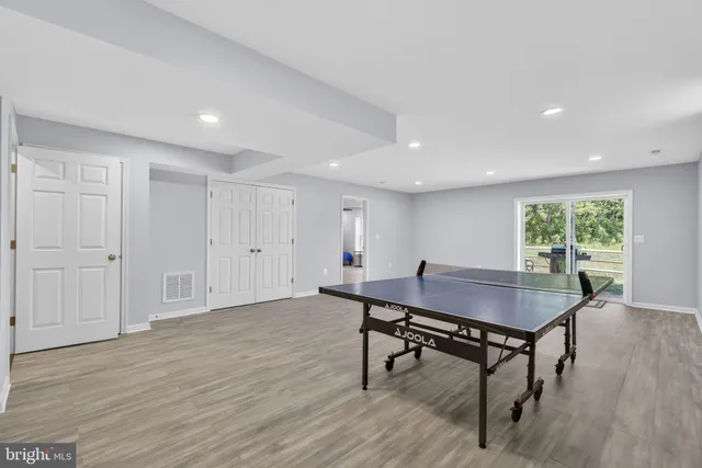 an aerial view of a house with outdoor space pool seating area and yard