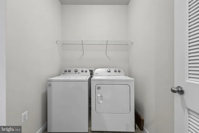 a open kitchen with stainless steel appliances granite countertop a lot of counter space and wooden floors