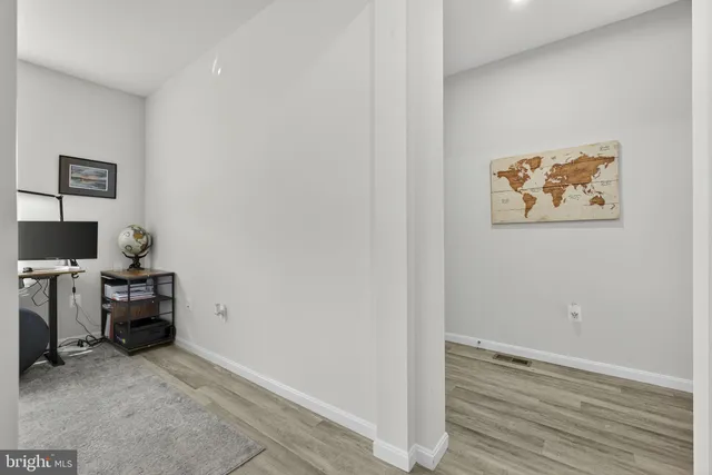 a kitchen with stainless steel appliances granite countertop a sink and a refrigerator