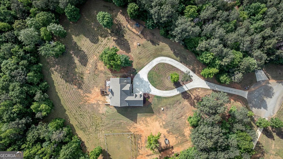 3093 Surry Ridge Drive Watkinsville, GA 30677 - Photo 4 of 41 an aerial view of a house with outdoor space and trees all around