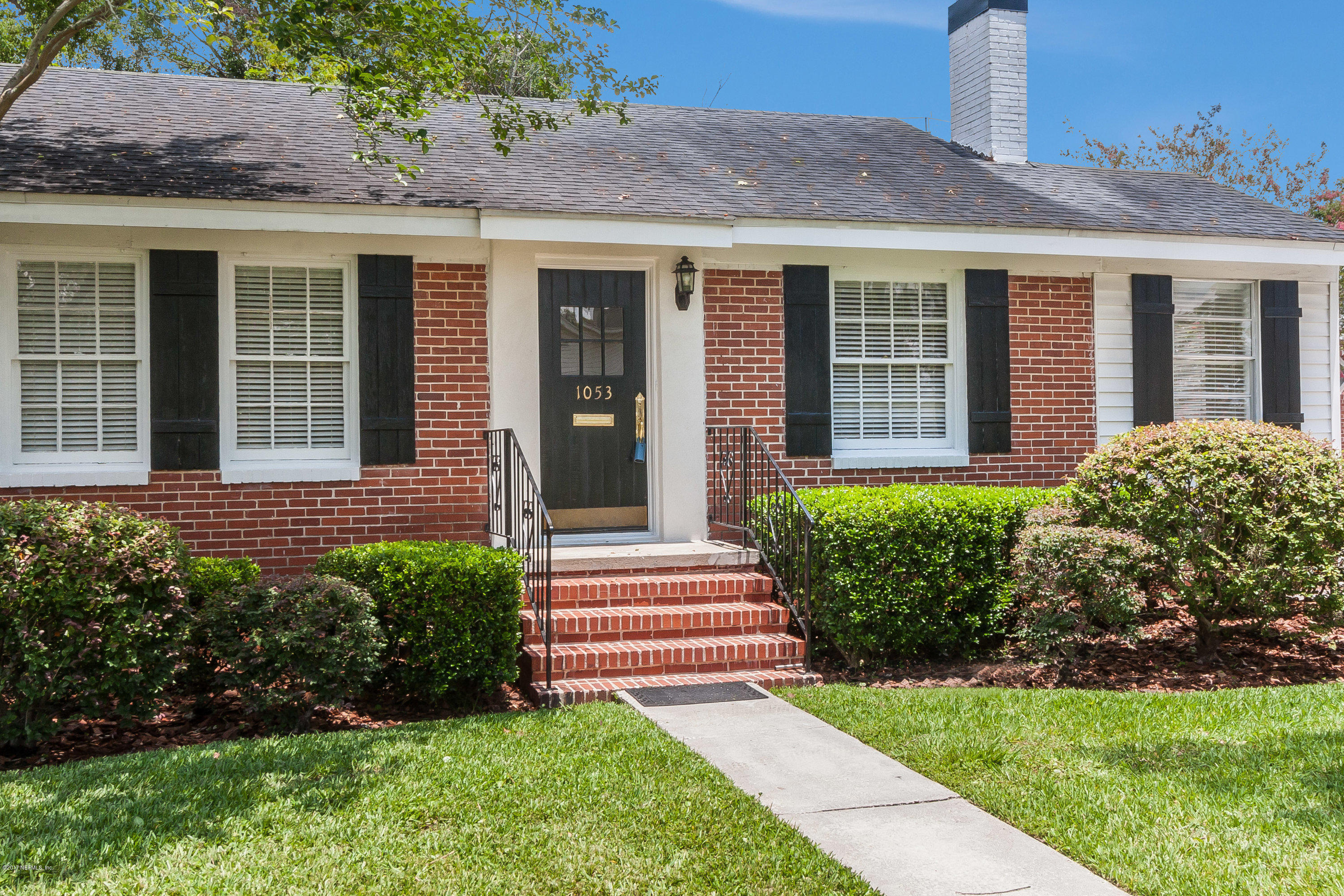 1053 Old Hickory Road Jacksonville, FL 32207 - Photo 3 of 25 a front view of a house with a yard