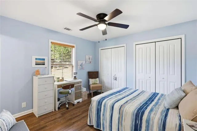 a bed room with a bed and a window