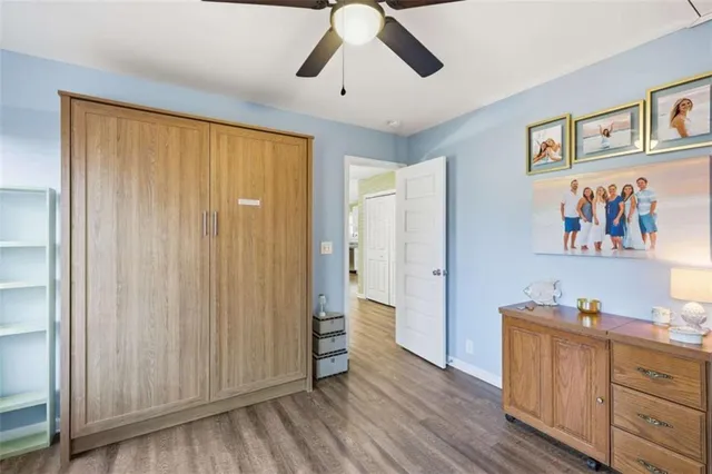 a view of a livingroom with wooden floor and closet