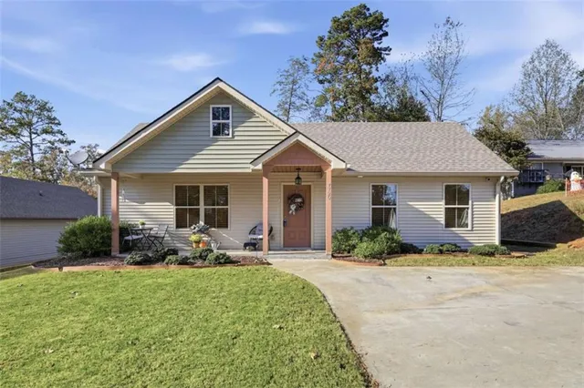 a front view of house with yard and green space