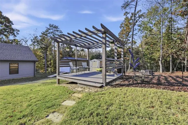 a view of a backyard with plants and a patio