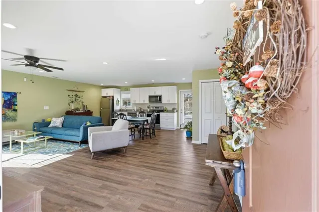 a living room with furniture and a potted plant