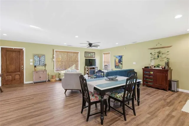 a view of a dining room with furniture and wooden floor