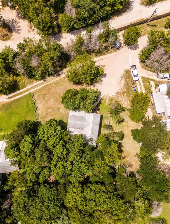 14275 Gholson Road Gholson, TX 76705 - Photo 22 of 22 Property featuring abundant mature trees and a metal roof structure