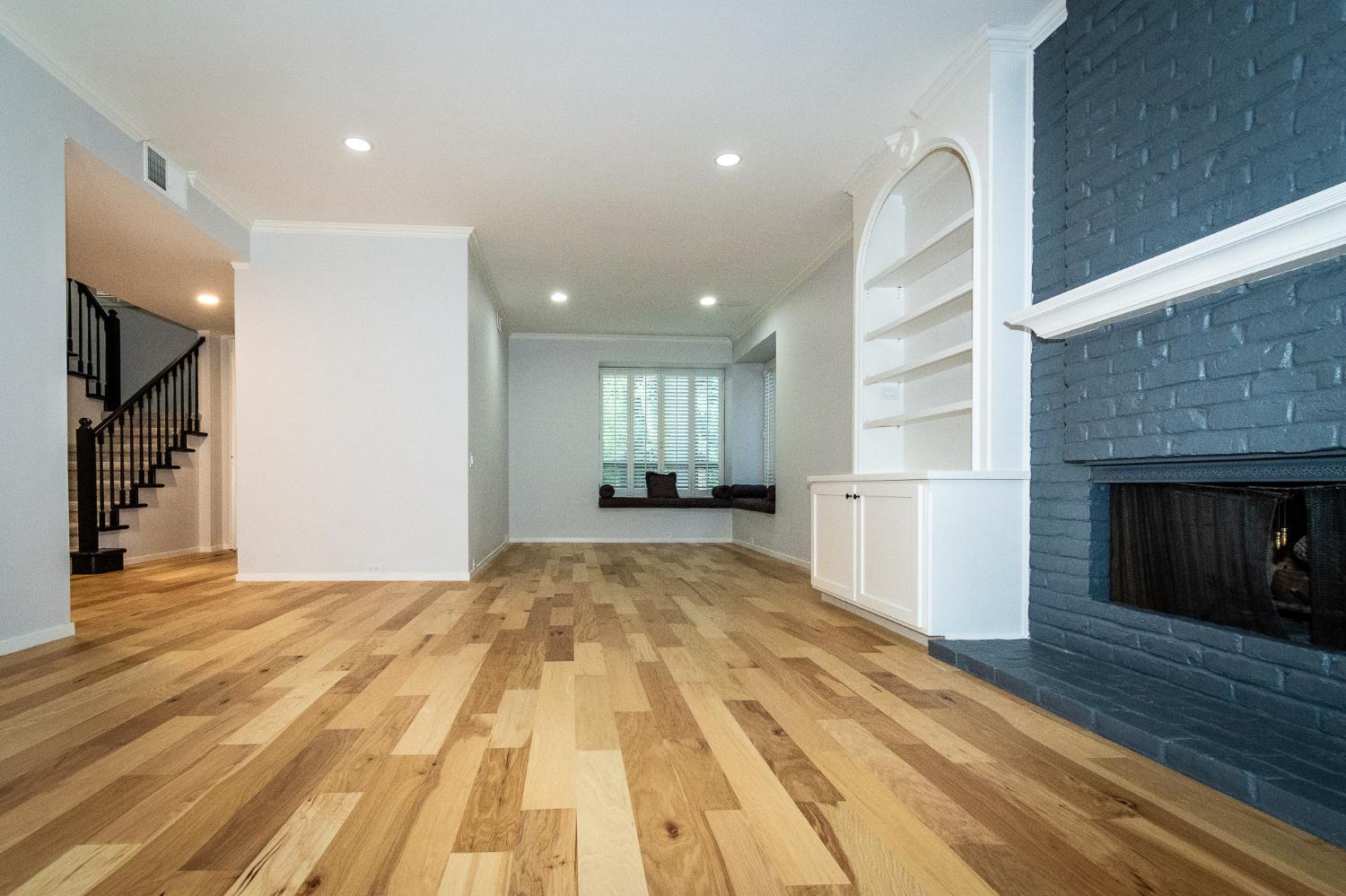 427 Wyndgate Road Sacramento, CA 95864 - Photo 11 of 36 a view of empty room with wooden floor and fireplace