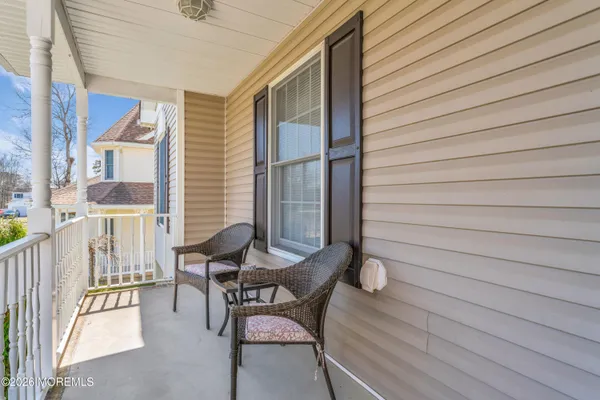 a view of a balcony with chairs