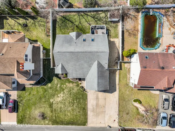 an aerial view of residential houses with outdoor space