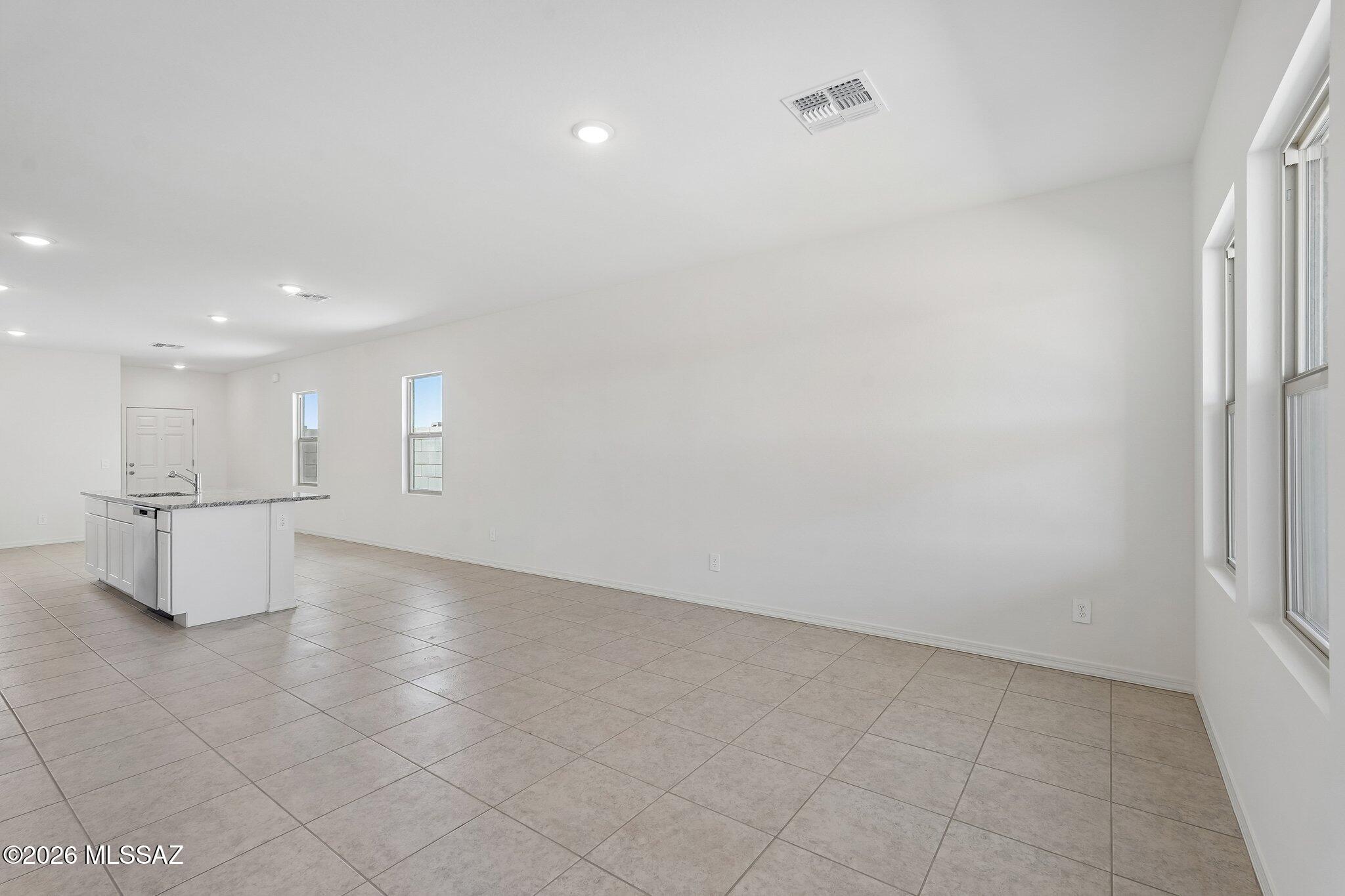 6735 West Star Wash Loop Tucson, AZ 85757 - Photo 13 of 16 SL_Sterling_Family_Room_Kitchen_B (2)