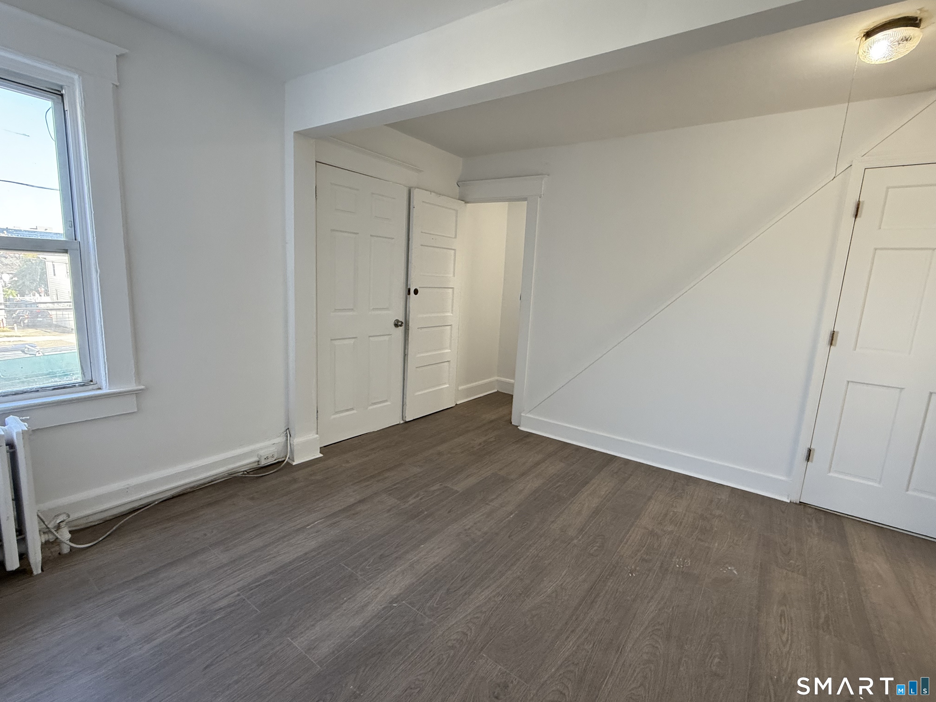 60 Stephen Street Stamford, CT 06902 - Photo 8 of 29 From 2nd Fl Bedroom#3 look towards Living Room, door to Office, door to 3rd Floor, and door to the 1st Floor