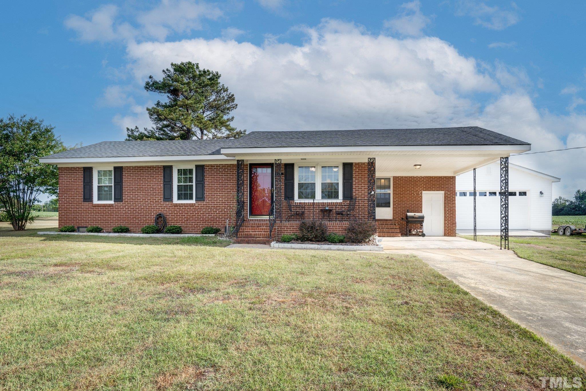 617 3rd Street Spring Hope, NC 27882 - Photo 1 of 23 a front view of house with yard and trees
