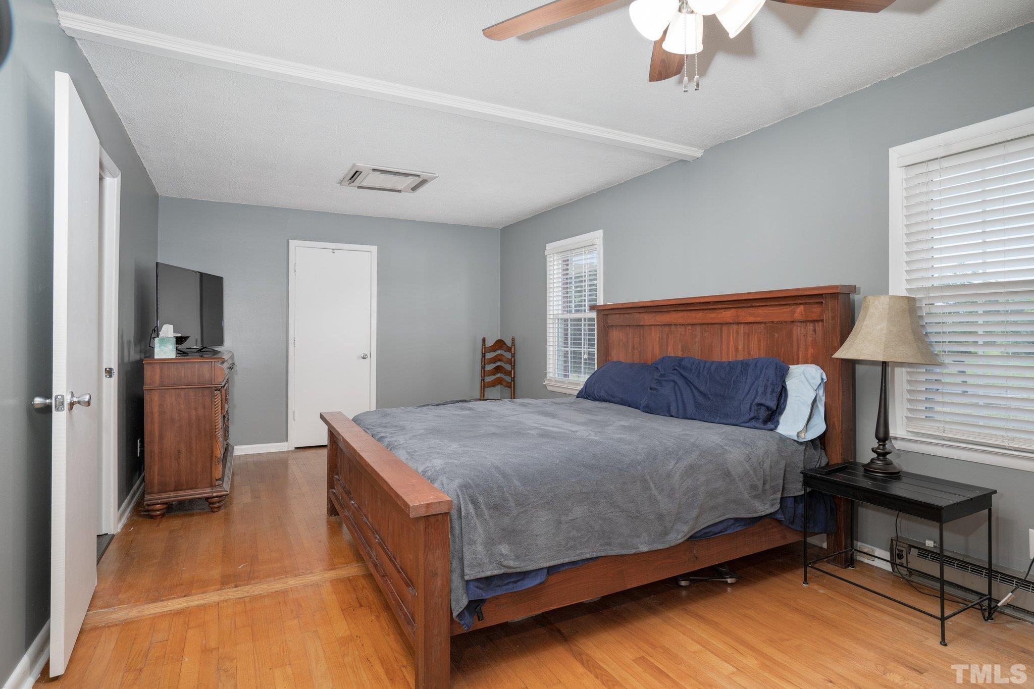 617 3rd Street Spring Hope, NC 27882 - Photo 4 of 23 a bedroom with a bed and a table