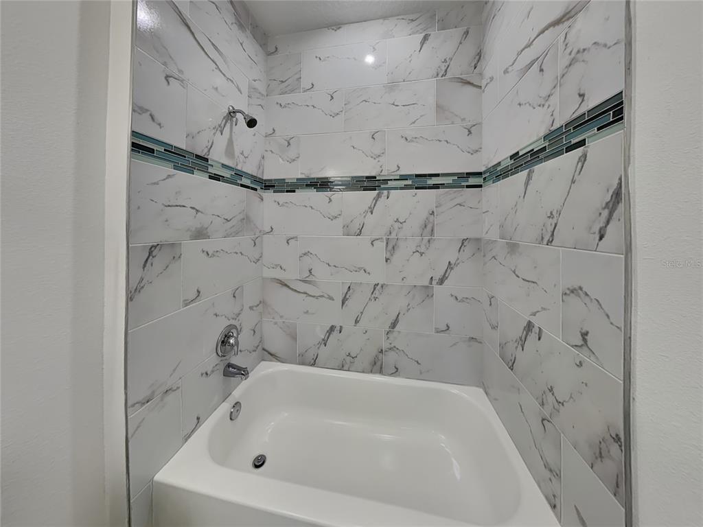 8809 North Sandree Drive Citrus Springs, FL 34434 - Photo 15 of 16 a bathroom with a bathtub