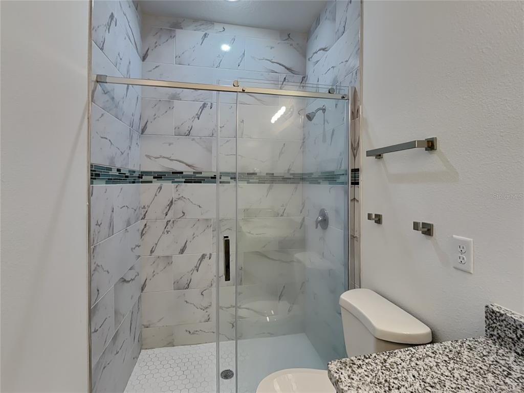 8809 North Sandree Drive Citrus Springs, FL 34434 - Photo 8 of 16 a bathroom with a shower and toilet