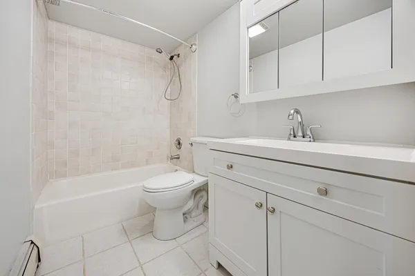 a bathroom with a sink a toilet and a bathtub