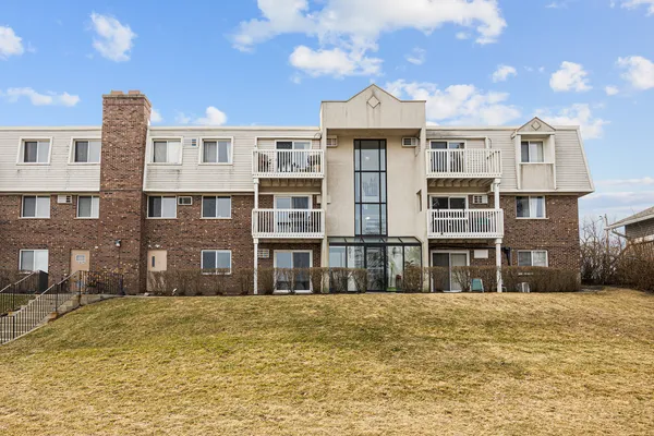 a front view of residential houses with yard