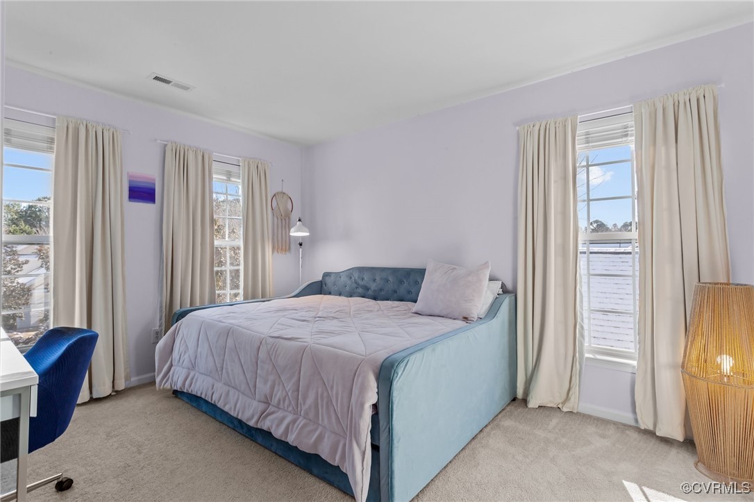 4405 Acoma Circle Williamsburg, VA 23188 - Photo 23 of 44 a bedroom with a bed and large windows