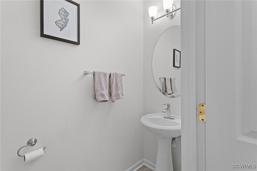 4405 Acoma Circle Williamsburg, VA 23188 - Photo 4 of 44 a bathroom with a sink and mirror