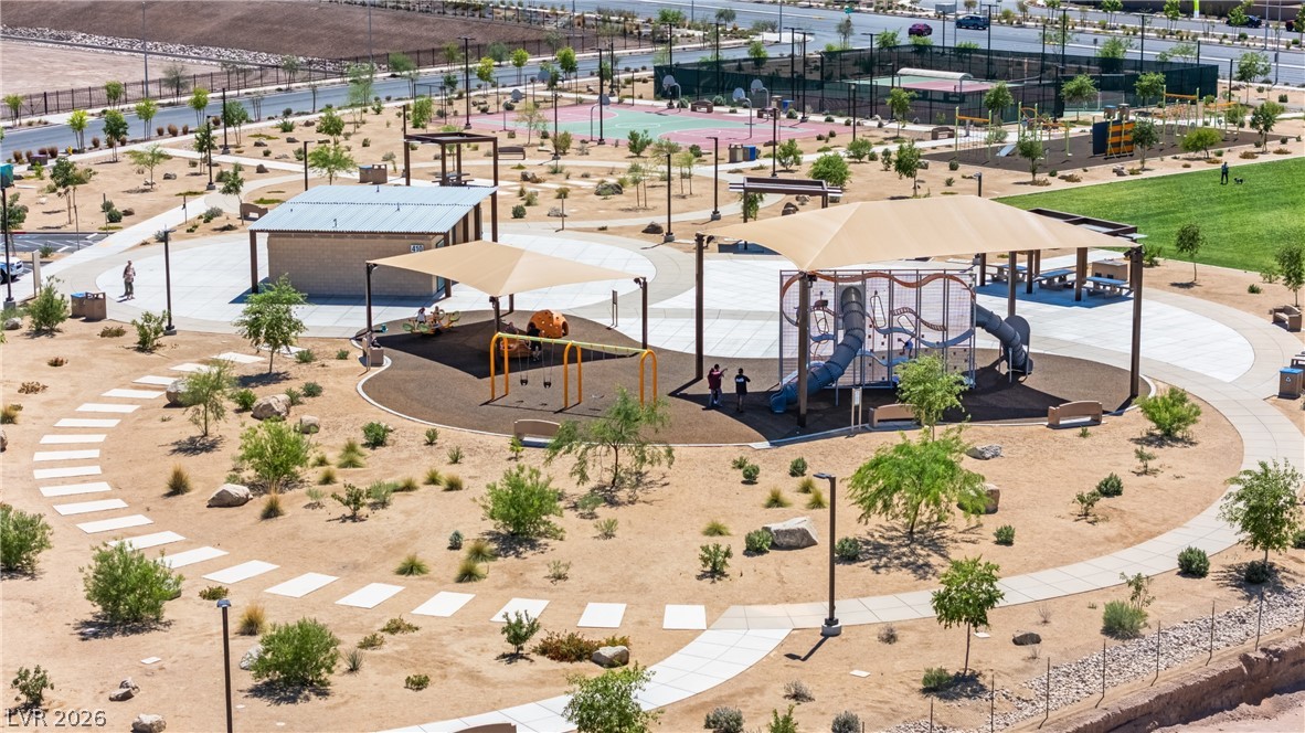 320 Isla Enclave Way Henderson, NV 89011 - Photo 46 of 49 This community park features play structures, recreational courts, and inviting walking paths for leisure and activity.