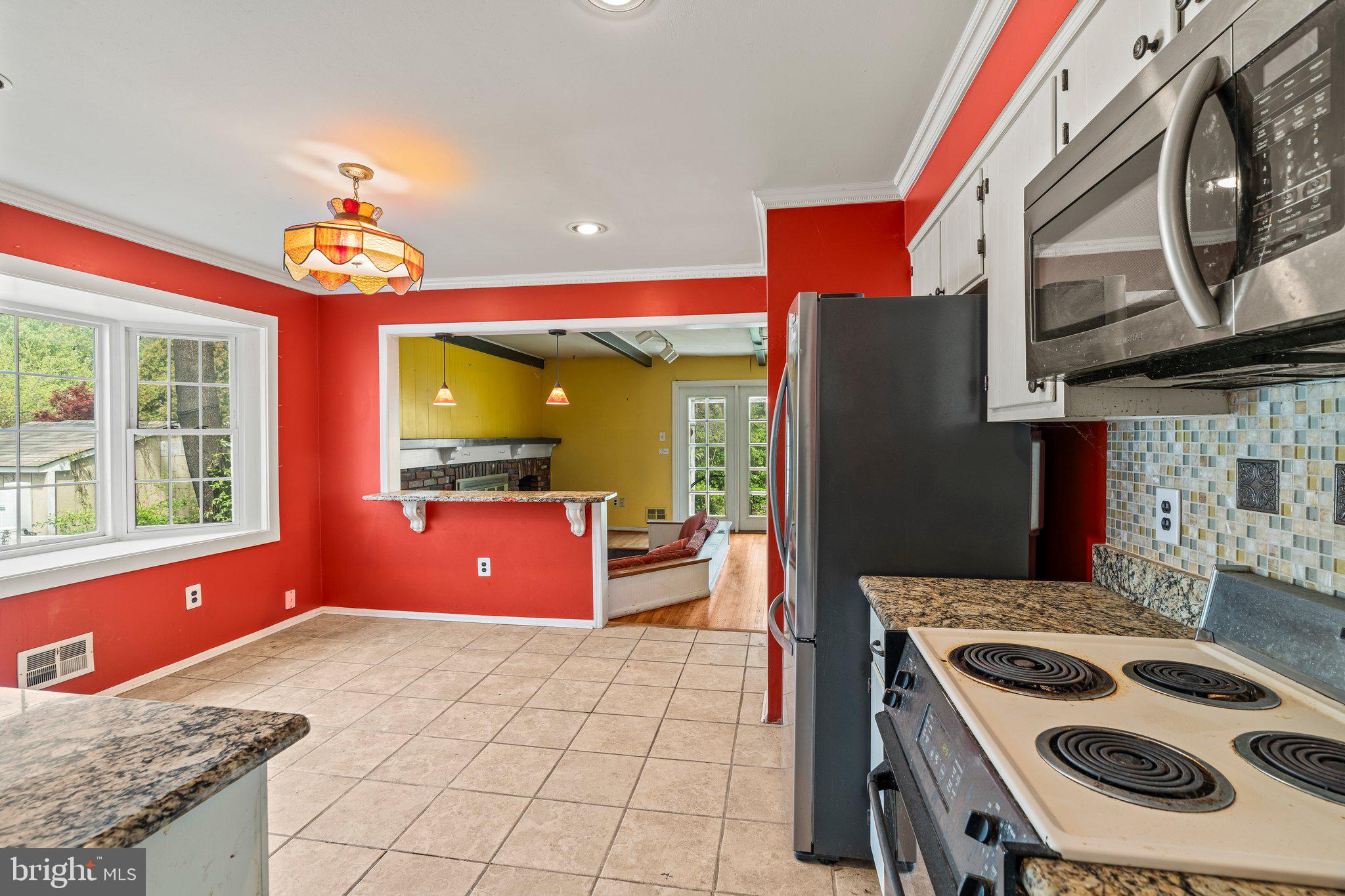 304 Bortons Mill Road Cherry Hill, NJ 08034 - Photo 12 of 35 a kitchen with stainless steel appliances granite countertop a stove a sink and a microwave