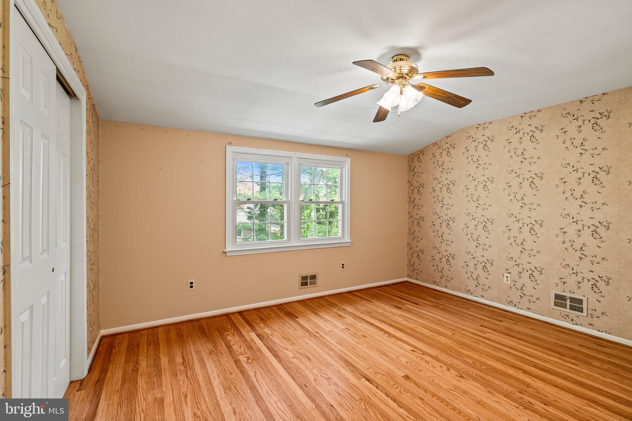 304 Bortons Mill Road Cherry Hill, NJ 08034 - Photo 22 of 35 a view of an empty room with wooden floor and a window