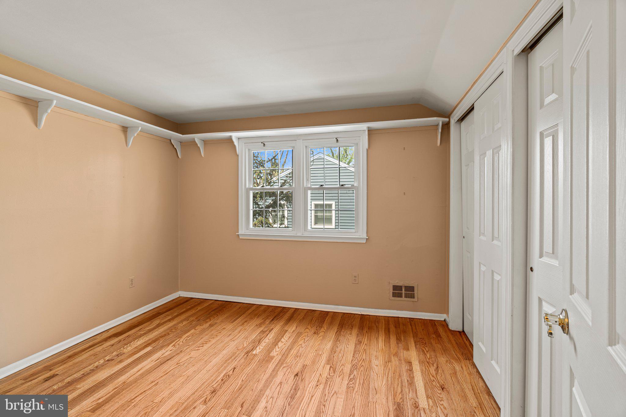 304 Bortons Mill Road Cherry Hill, NJ 08034 - Photo 24 of 35 a view of an empty room with wooden floor and a window
