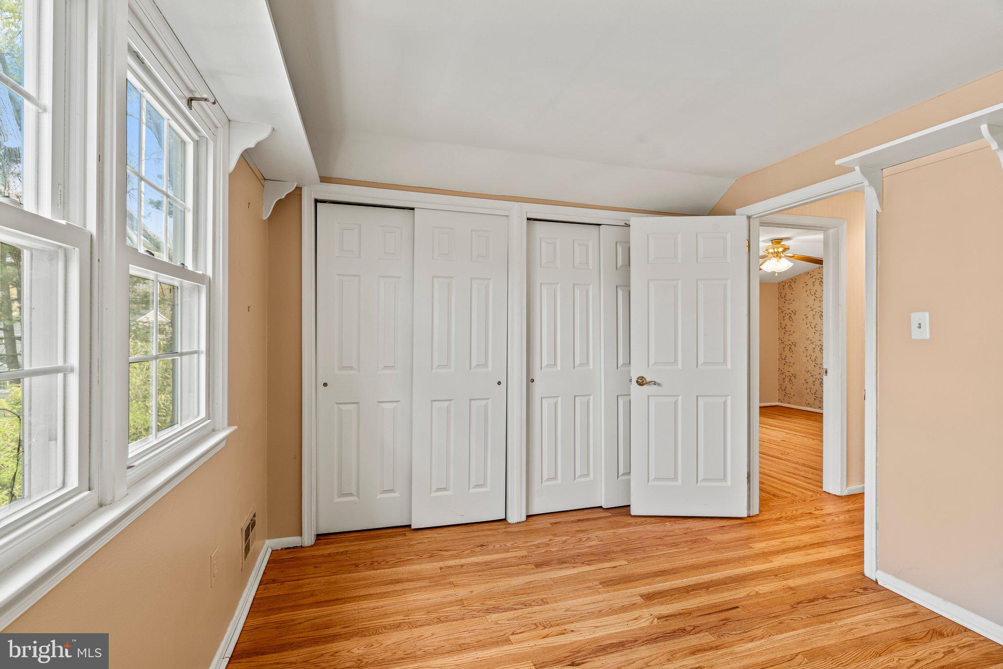 304 Bortons Mill Road Cherry Hill, NJ 08034 - Photo 25 of 35 a view of an empty room with wooden floor and a window