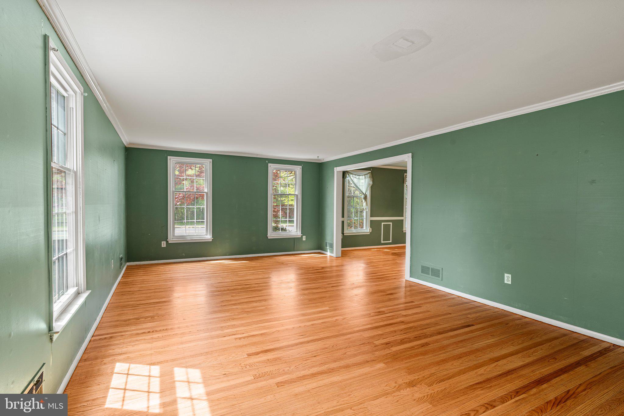 304 Bortons Mill Road Cherry Hill, NJ 08034 - Photo 6 of 35 a view of an empty room with wooden floor and a window