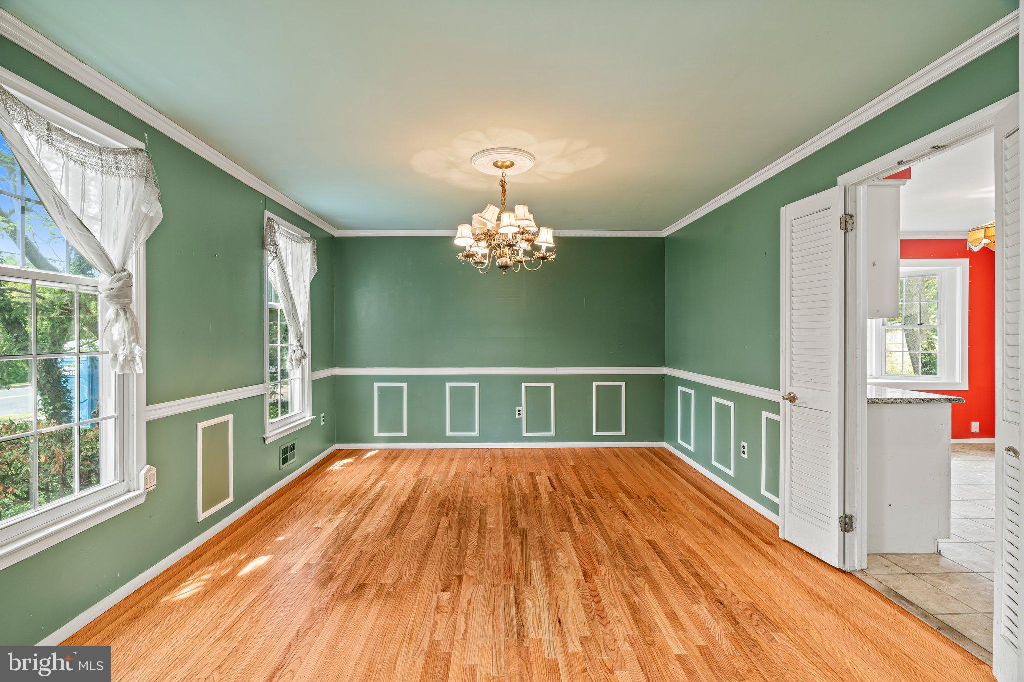 304 Bortons Mill Road Cherry Hill, NJ 08034 - Photo 9 of 35 a view of a hallway with wooden floor and chandelier