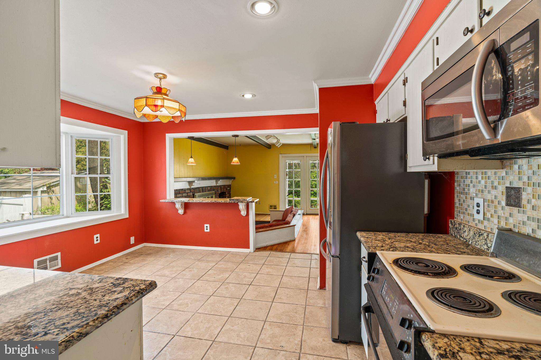 304 Bortons Mill Road Cherry Hill, NJ 08034 - Photo 10 of 35 a kitchen with stainless steel appliances granite countertop a stove a sink and a refrigerator