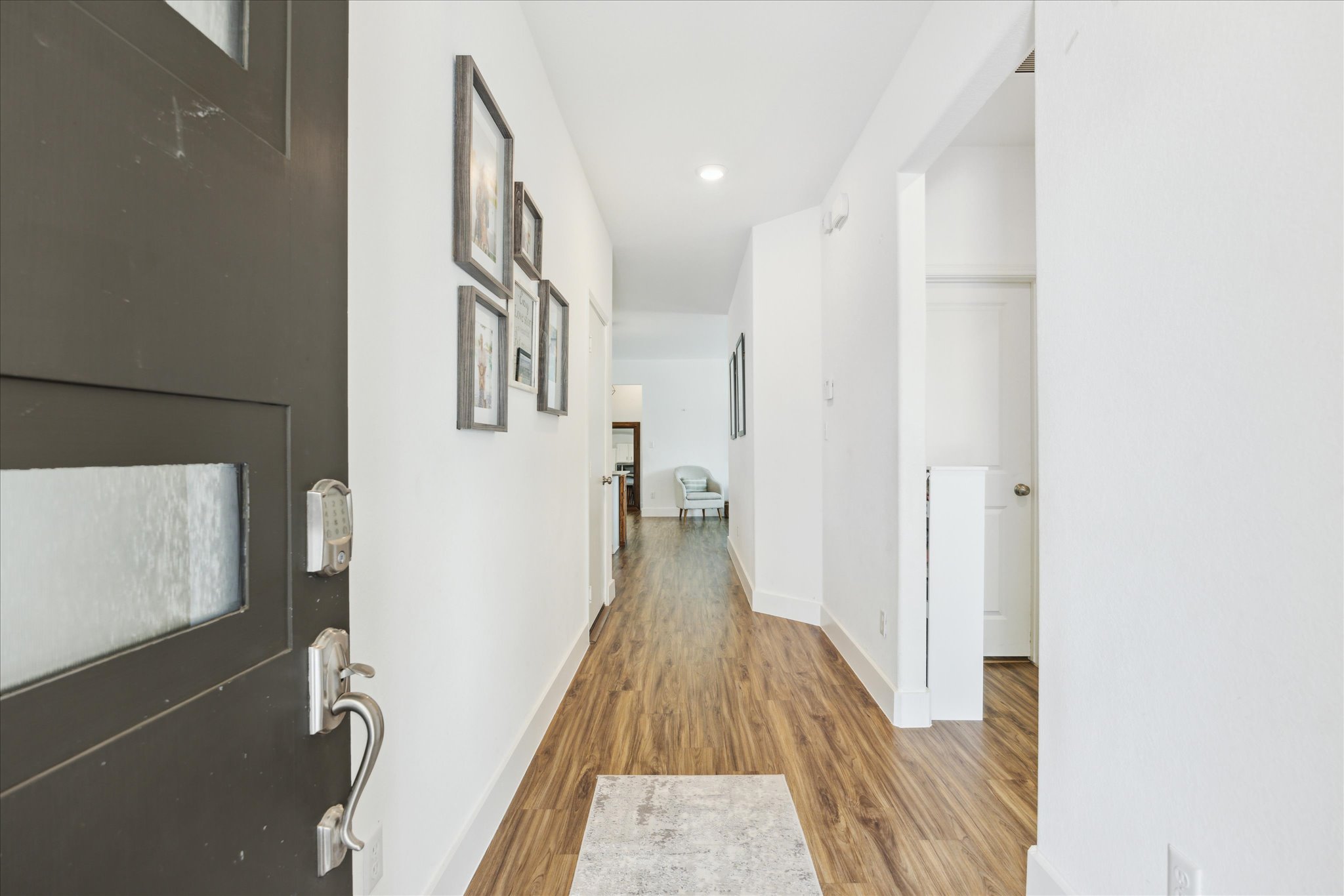 700 Legends Lane Georgetown, TX 78628 - Photo 5 of 31 Hall with light wood-style flooring and baseboards