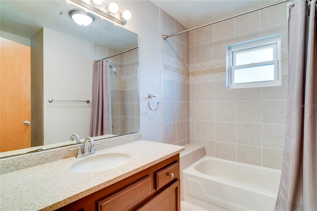 1504 East Spring Ridge Circle Winter Garden, FL 34787 - Photo 11 of 21 a bathroom with a bathtub and a sink
