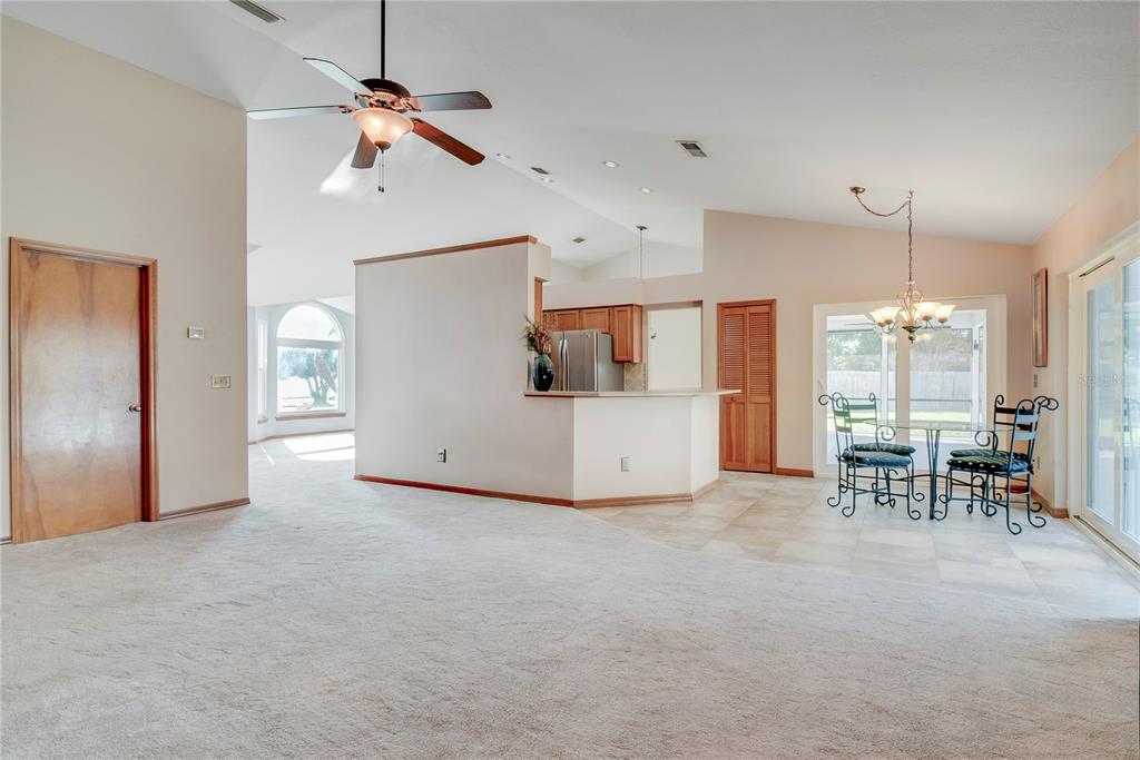 1504 East Spring Ridge Circle Winter Garden, FL 34787 - Photo 14 of 21 a view of a kitchen with furniture and a ceiling fan