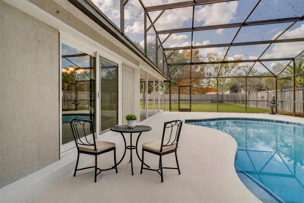 1504 East Spring Ridge Circle Winter Garden, FL 34787 - Photo 20 of 21 a view of a swimming pool with a lounge chair