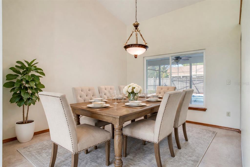 1504 East Spring Ridge Circle Winter Garden, FL 34787 - Photo 5 of 21 a view of a dining room with furniture window and wooden floor