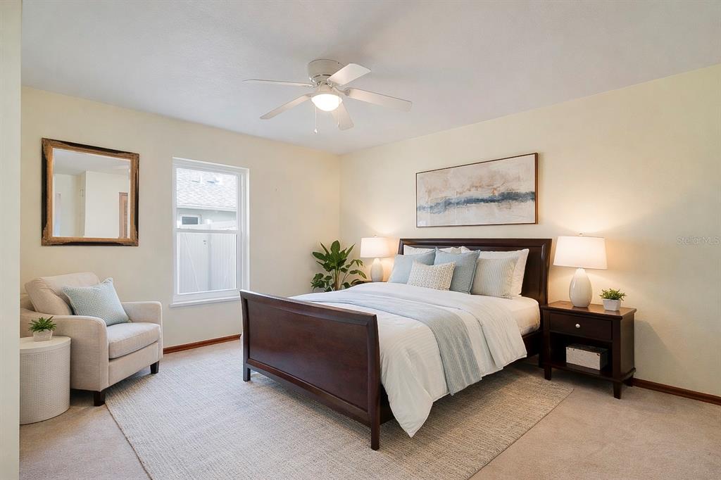 1504 East Spring Ridge Circle Winter Garden, FL 34787 - Photo 9 of 21 a spacious bedroom with a bed and couch