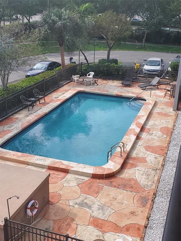 a view of swimming pool from a yard