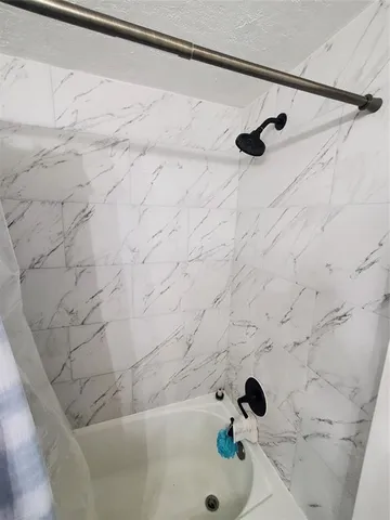 a bathroom with a sink toilet and a mirror