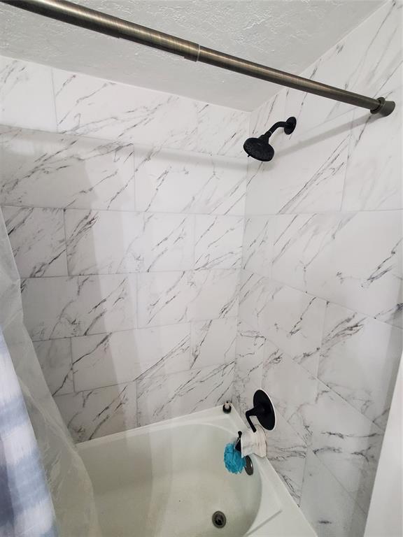 1021 Northeast 24th Avenue, Unit 4 Pompano Beach, FL 33062 - Photo 7 of 21 a bathroom with a bathtub