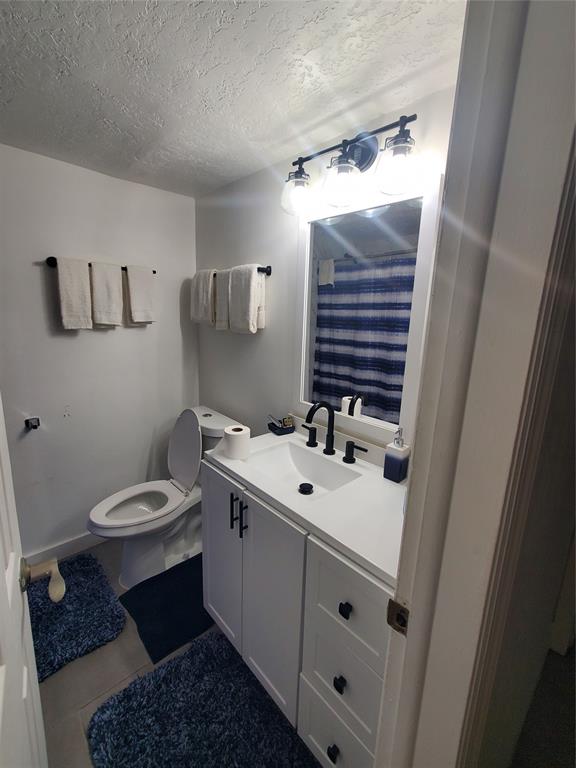 1021 Northeast 24th Avenue, Unit 4 Pompano Beach, FL 33062 - Photo 8 of 21 a bathroom with a sink toilet and a mirror