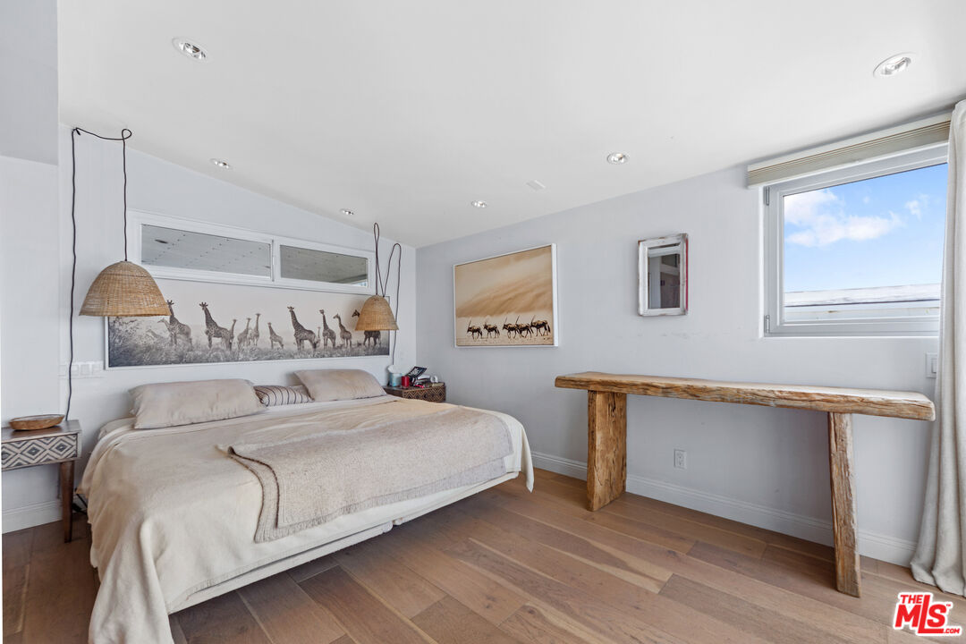 29500 Heathercliff Road, Unit 184 Malibu, CA 90265 - Photo 16 of 46 a bedroom with a large bed and a window