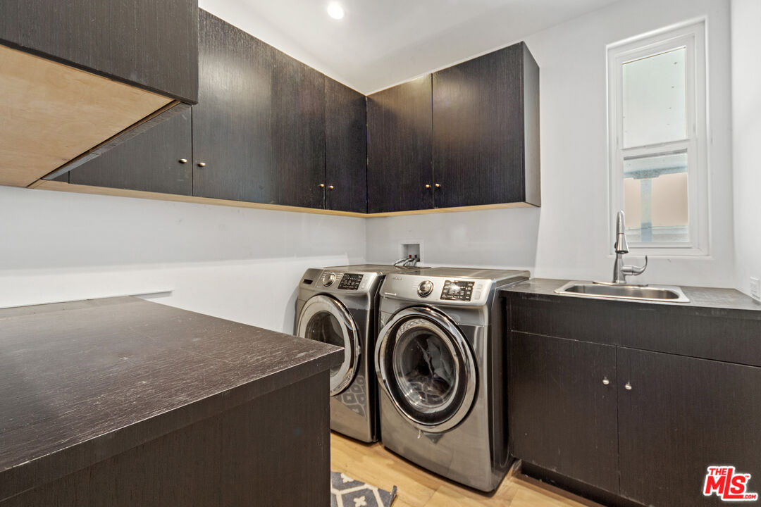 29500 Heathercliff Road, Unit 184 Malibu, CA 90265 - Photo 19 of 46 a utility room with sink dryer and washer